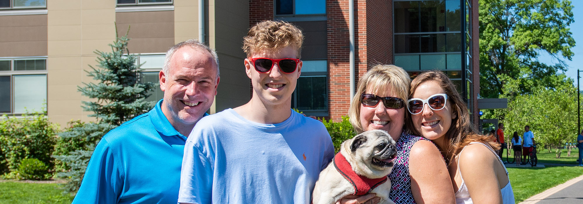 family outside of ridgeview hall